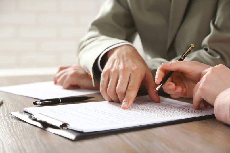 Human hands working with documents at the desk closeup