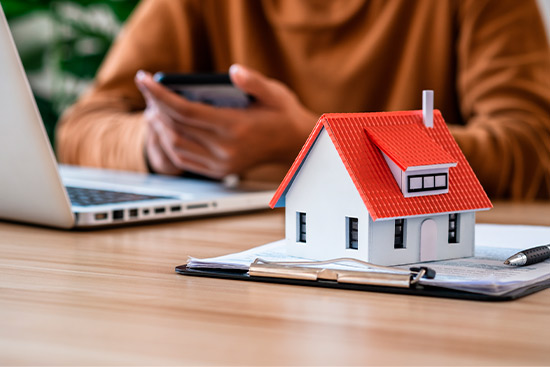 home protection Woman using cellphone and laptop for coverage 