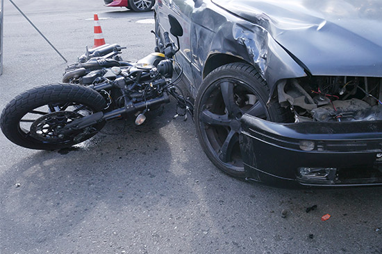 A motorcycle positioned in the center of a road, highlighting its importance in South Texas biking culture.