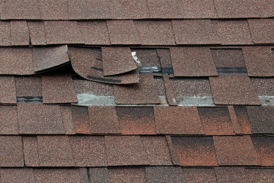 Ripped Shingle on Mansard Roof